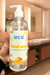 Eco-friendly citrus hand soap bottle in a washroom, promoting a plant-based and sustainable home.